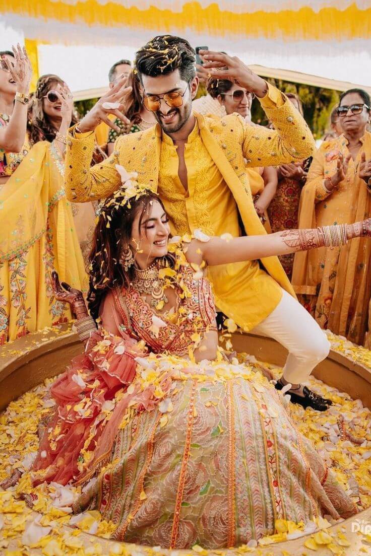 Fun haldi shots of bride and groom